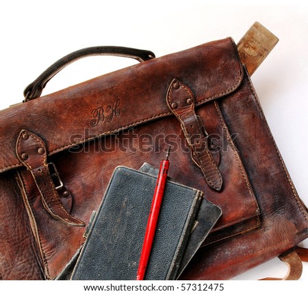 Close up of vintage schoolbag with pen and notes