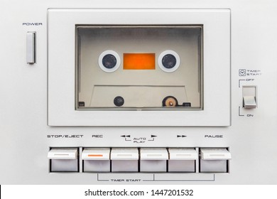 Close up of a vintage silver audio cassette player with buttons