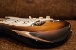 Close Up Of Vintage Worn Fender Stratocaster Body In Sunburst Finish