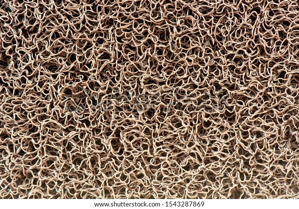 Close up of Vinyl dust trap carpet texture\
background. Abstract background concept for pattern and design.\
Industrial Yellow vinyl carpet Coil Pattern Car Floor Mat texture.\
anti slippery surface