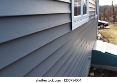 Close Up Of Vinyl Siding On Property Development; Real Estate Background