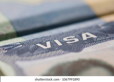 Close Up Of A Visa Spamp In A Passport. Immigration And Emigration Concept