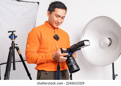 close up of vlogger man standing setting camera with lighting equipment background in isolated - Powered by Shutterstock