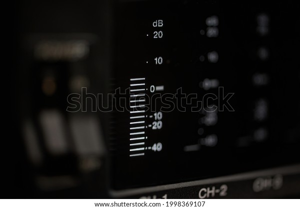 Close up of a volume meter of a video player\
with several audio channels, a volume meter indicates the intensity\
of the sound in decibels