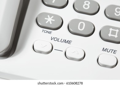 Close Up Of Volume And Mute Buttons On A Landline Phone 