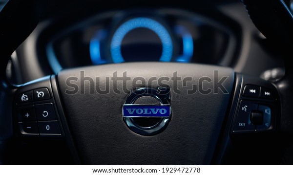 Close up Volvo logo on the steering wheel. Volvo V40\
dashboard interior. 