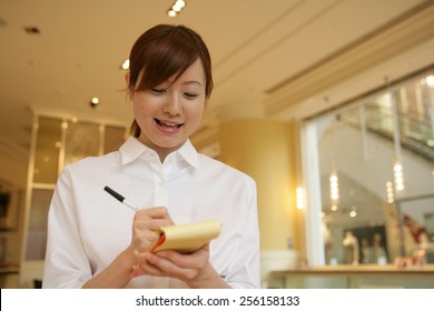 Close up of a waitress taking an order