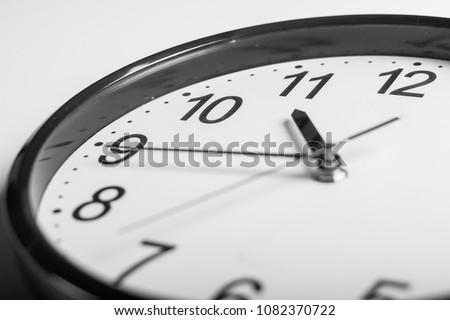 close up a wall clock that 20 min before 11 o'clock