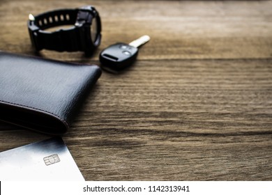 Close up wallet Credit Cards watch and car key on the old wood floor Holiday concept Travel Accessories for texture - Powered by Shutterstock