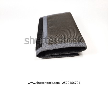 close up of a wallet made of polyester material on a white background