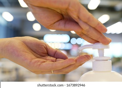 Close Up Washing Hand With Alcohol Sanitizer In Department Store.