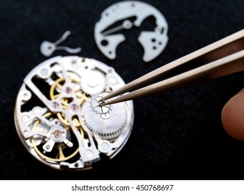 close up of watchmaker Working On A vintage Mechanical Watch. - Powered by Shutterstock