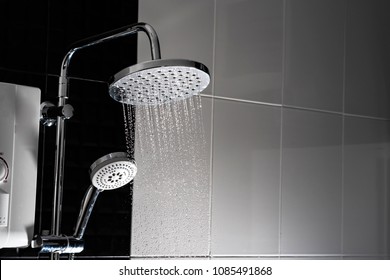 Close Up Of Water Flowing From Shower In The Bathroom