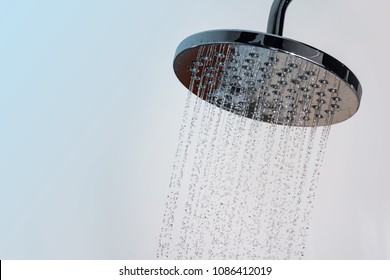 Close Up Of Water Flowing From Shower In The Bathroom