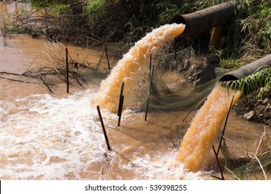 Close up of water gushing from the sewer to the coop in rural canals which flow stops recording.