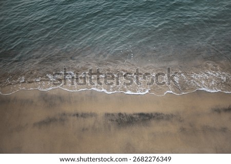 Close up of wavelets on the sand