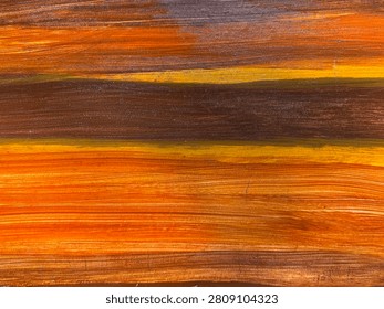 Close up of weathered and decayed solid wood texture with colorful vibrant paint color, brown, yellow, blue, and red. Seamless timber solid wood background texture