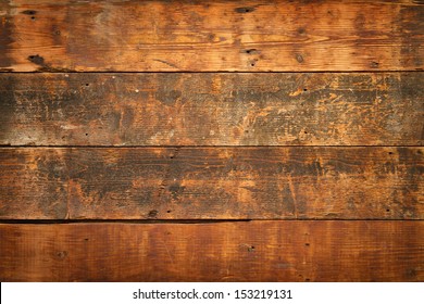 close up of  weathered and textured boards on an old wooden farm door - Powered by Shutterstock