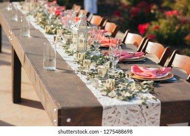 Close up of wedding reception table setup outdoors.