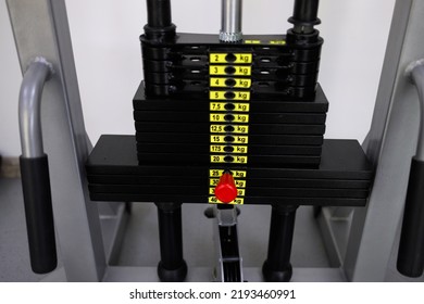 Close Up Of Weights On Exercise Machine In Gym