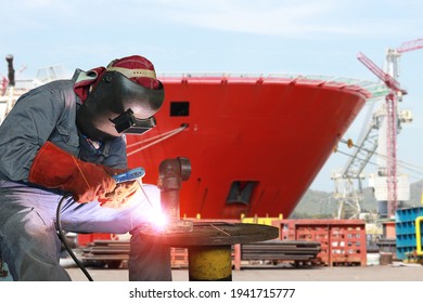 Close Up Welder Is Welding Process Arc Spark Factory At Shipbuilding And Ship Repairing Industrials, Wear Equipment Protective For Safety