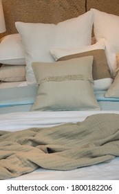 Close Up Well Made Bed With Pastel Color Pillows And Bedspread, High Angle View