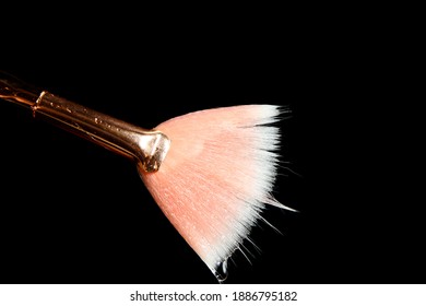 Close Up Of Wet Make Up Brush Against Black Background