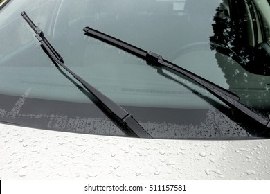 Close Up Of Wet Windshield Reflections Patterns Textures And Wiper Blades And Arms 