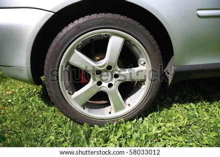 Close up wheel of a silver car