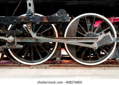 Close Up Wheels On Stream Powered Locomotive. Southeastern Railway Museum