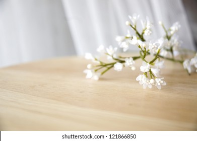 close up white artificial flowers put on table - Shutterstock ID 121866850