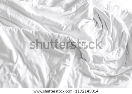 Close up of white bedding sheets with copy space