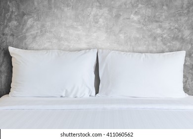 Close Up White Bedding Sheets And Pillow In Hotel Room