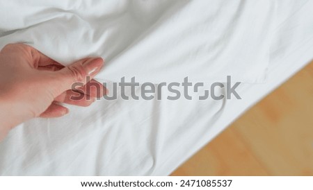 close up of white bedsheet background ,good hotel service. High quality photo