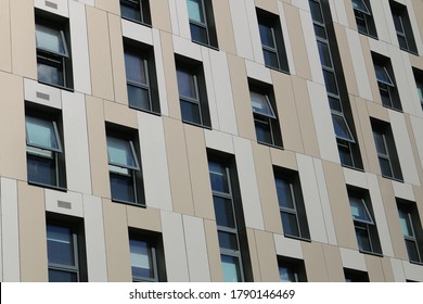 Close up of white and beige cladding from a student accommodation block. White and beige cladding in England.