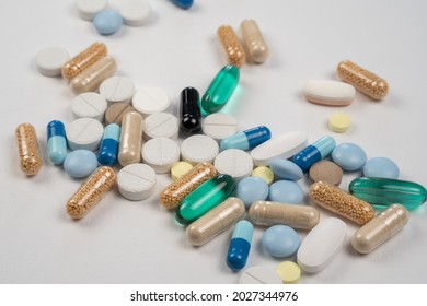 Close Up Of White And Colorful Medicines Pils And Capsules. Medical Background.