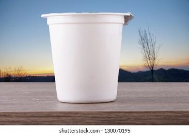 Close Up Of A White Cup Of Yoghurt