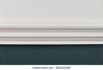 Close Up Of White Dado Rail With White Above And Teal Blue Green Below