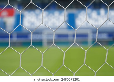 Close up white football goal net with blur background. - Powered by Shutterstock