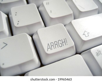 Close up of a white keyboard with the word "Arrrgh" super-imposed onto a key