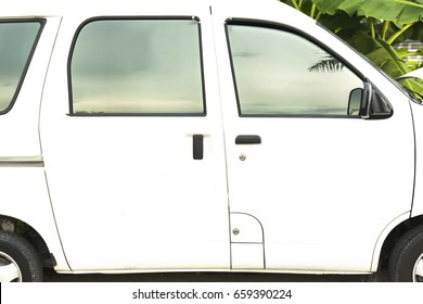 Close Up Of White Mini Van Door Handles - Side View