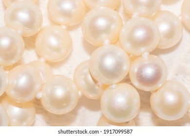 Close Up Of White Pearl Necklace On An Ivory Fabric - Regency Fashion Inspiration