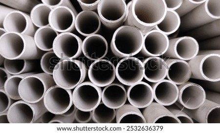 close up of white PVC pipe stack for construction industry