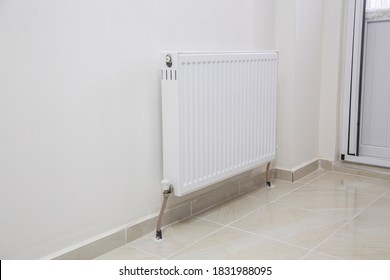 Close up white radiator in an apartment.