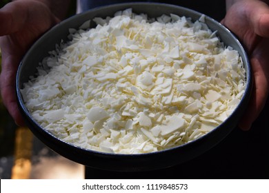 Close Up Of White Soy Wax Flakes For Candle Making In A Ceramic Bowl.