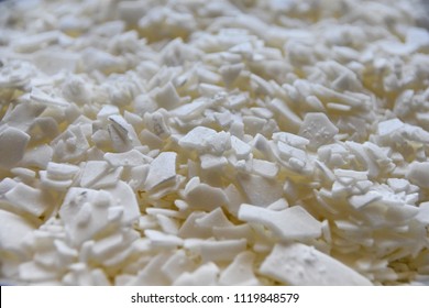 Close Up Of White Soy Wax Flakes For Candle Making In A Ceramic Bowl.