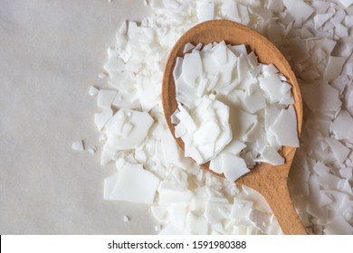 Close up of white soy wax flakes for candle making. Light texture of soy wax flakes. Ingredient for homemade candles. Ecological lifestyle - Shutterstock ID 1591980388