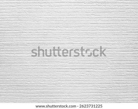 close up of a white surface featuring horizontal line textures