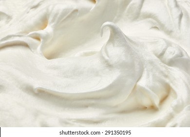 close up of  a white whipped or sour cream on white background