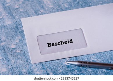 Close up of a white window envelope with address panel and german writting Bescheid, ideal for mail concepts, communication themes and administrative or office visuals